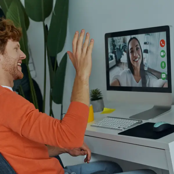Business owner smiling while viewing successful email stats with Webwise strategist