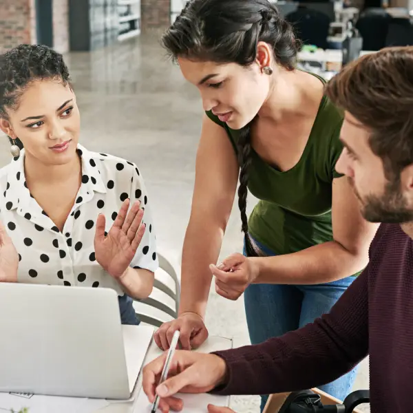 Marketers building a personalised email marketing strategy on a laptop