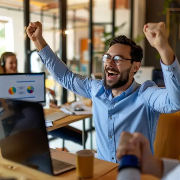 Happy business owner reviewing increased leads with digital marketing partner