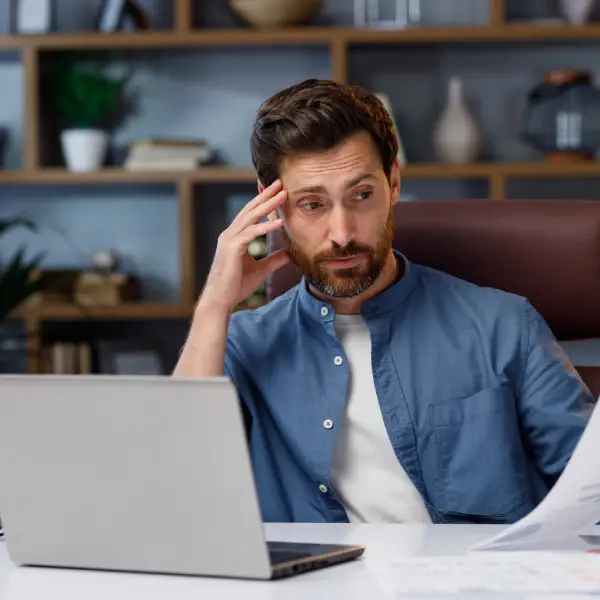 Marketing manager reviewing disappointing content metrics on screen