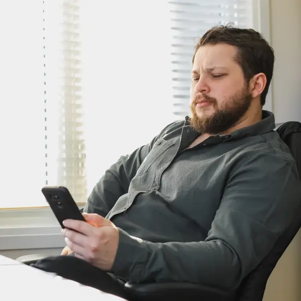 Frustrated entrepreneur scrolling through social media metrics showing low reach